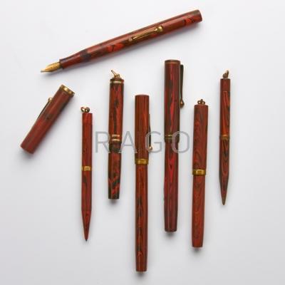 Appraisal: WAHL AND WATERMAN PENS OR PENCILS Seven orange or red