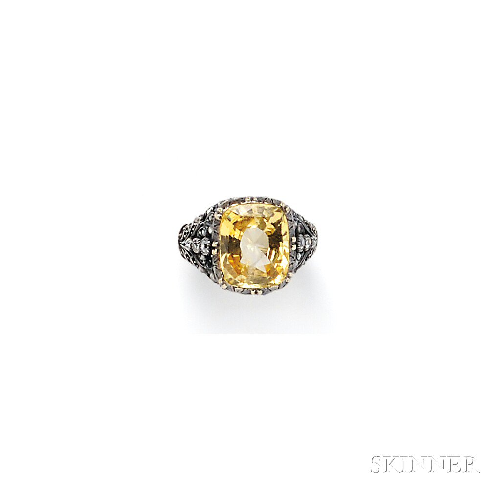 Appraisal: Yellow Sapphire and Diamond Ring set with a cushion-cut sapphire