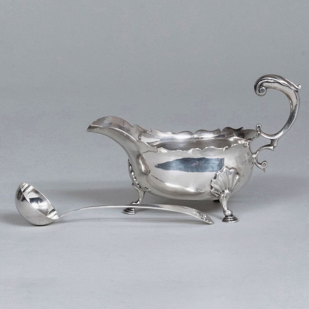 Appraisal: George II Silver Sauce Boat and a Ladle Each with