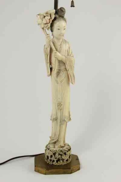 Appraisal: Japanese Carved Ivory Lamplate th century woman in robe holding