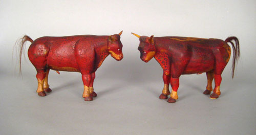 Appraisal: Pair of Pennsylvania carved and painted poplar bull figures th