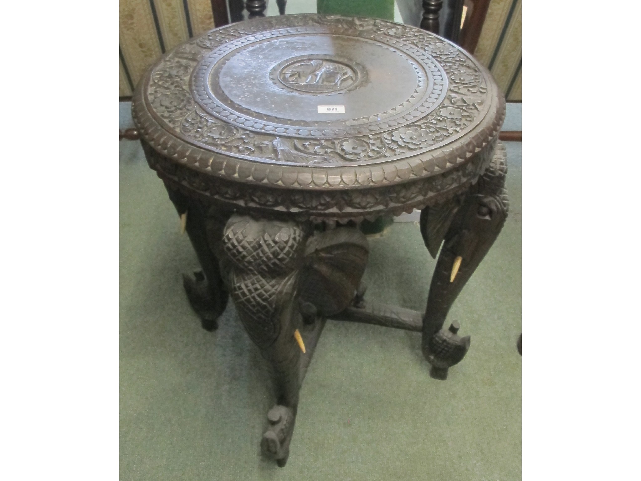 Appraisal: An Indian carved ebonised elephant table