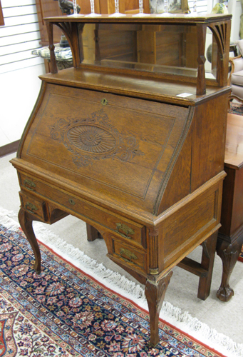 Appraisal: A LATE VICTORIAN OAK SLANT-FRONT SECRETARY American late th century