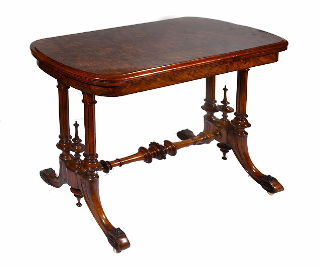 Appraisal: A VICTORIAN BURR WALNUT FOLD OVER TEA TABLE the fluted