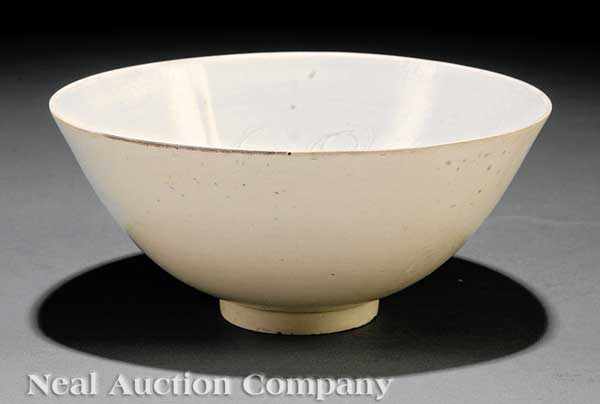 Appraisal: A Chinese Carved Dingyao Porcelain Bowl probably Song Dynasty -