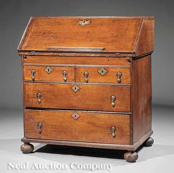 Appraisal: An English Oak Slant-Front Bureau early th c foldover writing