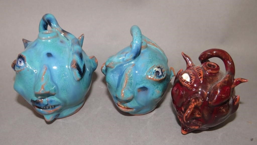 Appraisal: MINIATURE FOLK ART REDWARE FACE JUGS BY WES MUCKca all