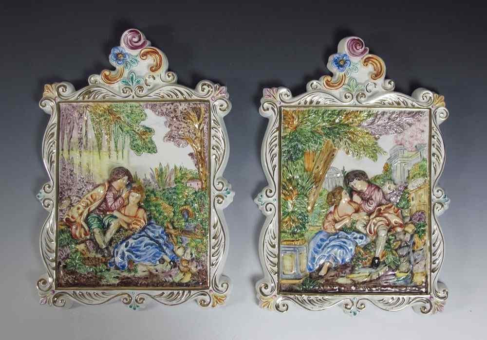 Appraisal: PAIR CAPO DI MONTE PLAQUES Featuring relief scenes of lovers