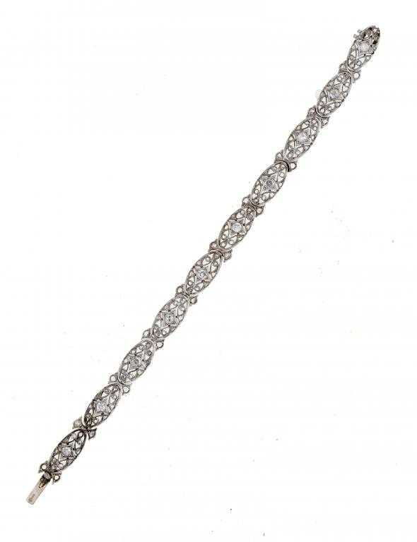 Appraisal: A DIAMOND BRACELET of ten oval openwork sections with diamond