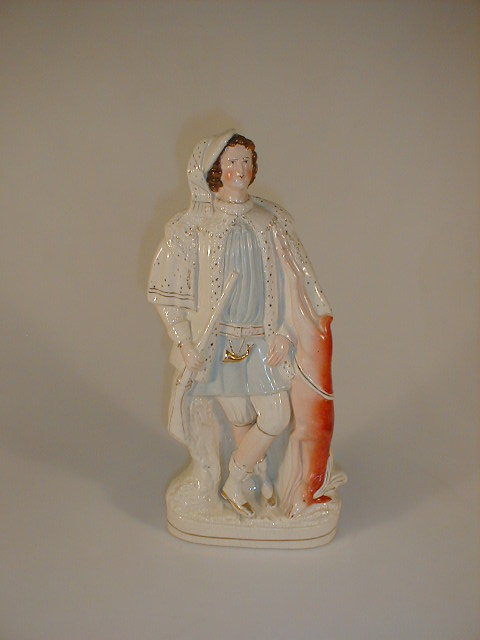 Appraisal: A thC Staffordshire figure of a huntsman a gun in