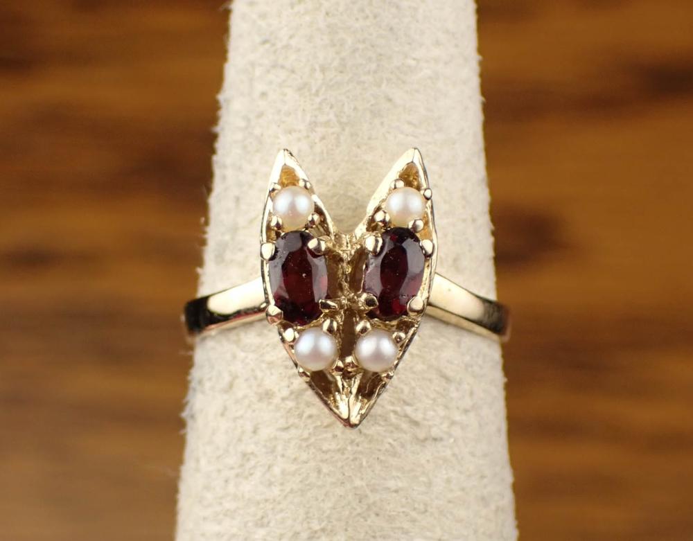 Appraisal: GARNET SEED PEARL AND FOURTEEN KARAT GOLD RING The yellow