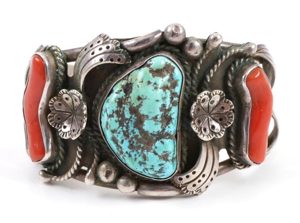 Appraisal: Vintage Navajo cuff bracelet with coral flanking a turquoise chunk