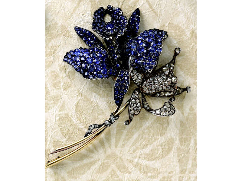 Appraisal: ANTIQUE SAPPHIRE AND DIAMOND ORCHID BROOCH Graceful silver topped k