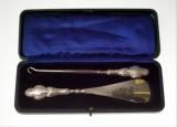 Appraisal: CONTINENTAL SILVER-HANDLED BUTTON HOOK AND SHOE HORN cased -