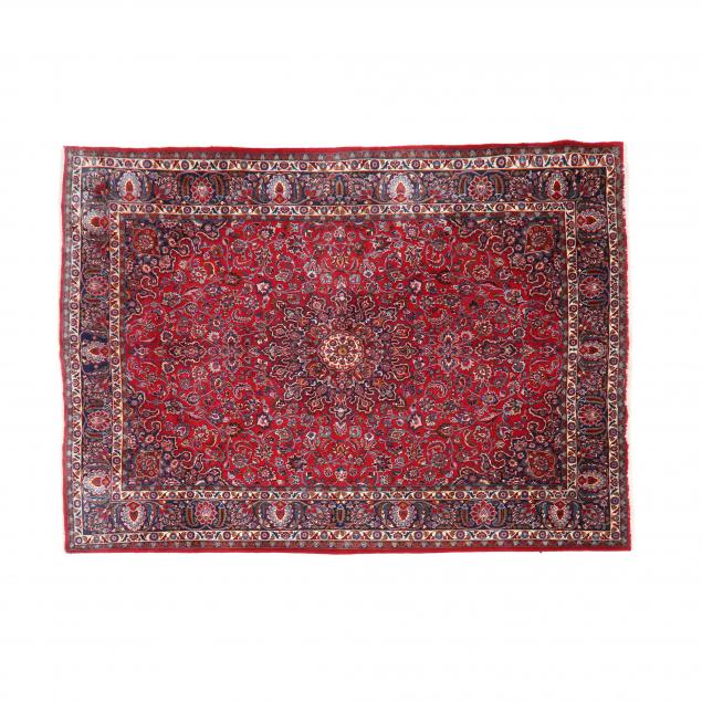 Appraisal: PERSIAN RUG Red field with central medallion blue main border