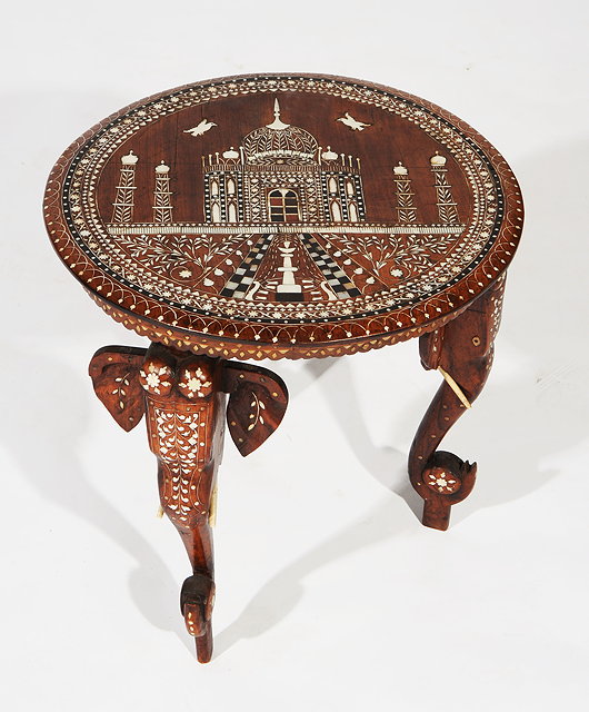 Appraisal: AN INDIAN BONE AND EBONY INLAID OCCASIONAL TABLE the circular