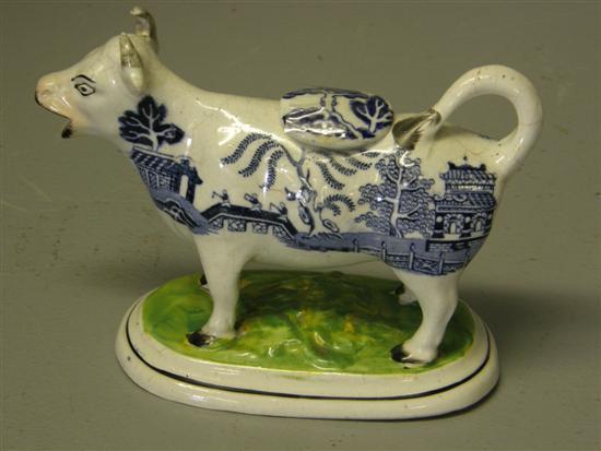 Appraisal: English pottery cow creamer with a blue and white printed