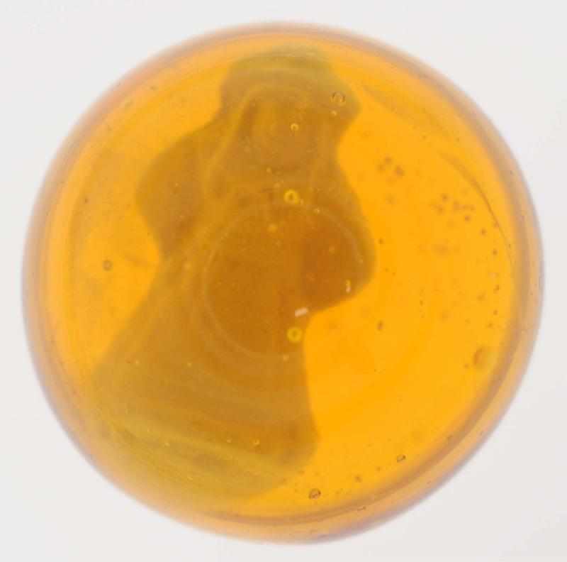 Appraisal: Amber Standing Lady Sulphide Marble Honey amber glass with lady