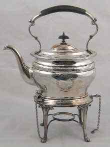 Appraisal: A silver oval kettle on stand with gadrooned rims and