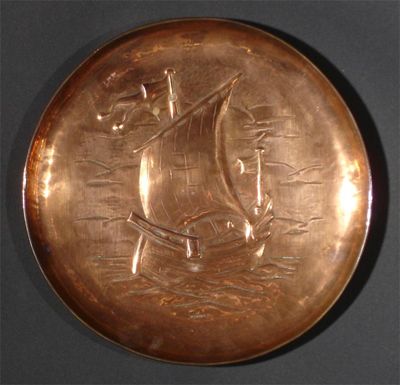 Appraisal: A Newlyn copper tray circular stamped with a sailing vessel