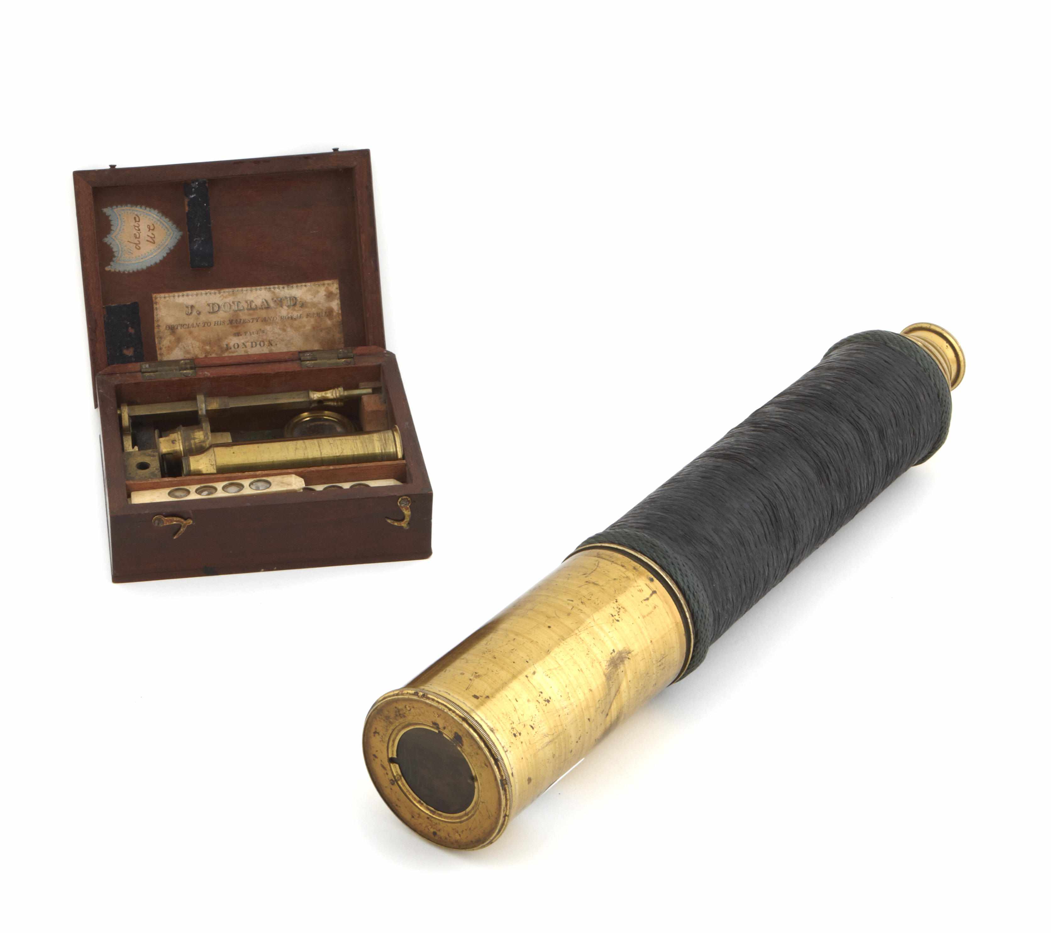 Appraisal: An English brass and leather two draw telescope together with