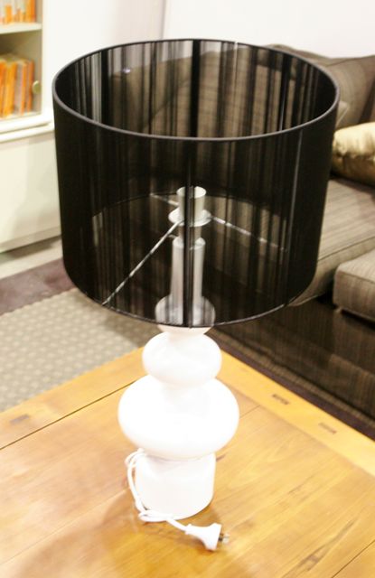 Appraisal: A white timber contemporary table lamp