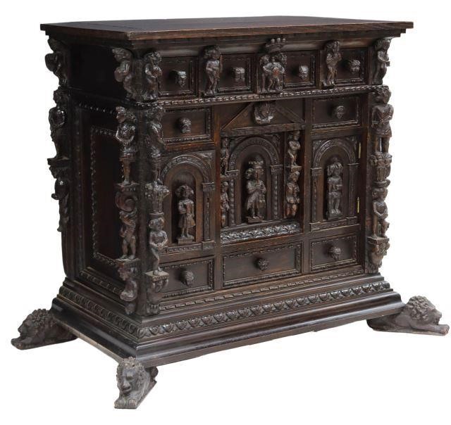 Appraisal: Spanish Renaissance Revival oak cabinet th c carved with figures