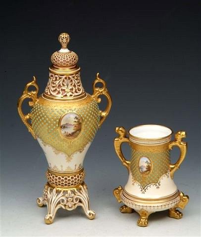 Appraisal: A COALPORT TWO HANDLED JEWELLED VASE raised on four paw