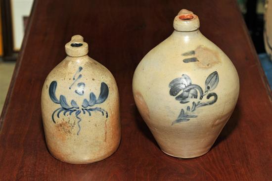 Appraisal: TWO STONEWARE JUGS A floral cobalt decorated ovoid handled jug