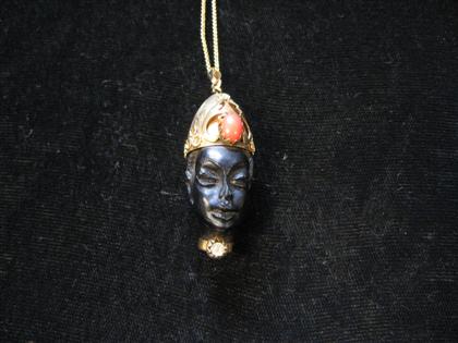 Appraisal: Blackamoor pendant on chain Yellow gold headdress and collar with