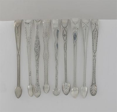 Appraisal: Nine various George III pairs of engraved sugar tongs oz