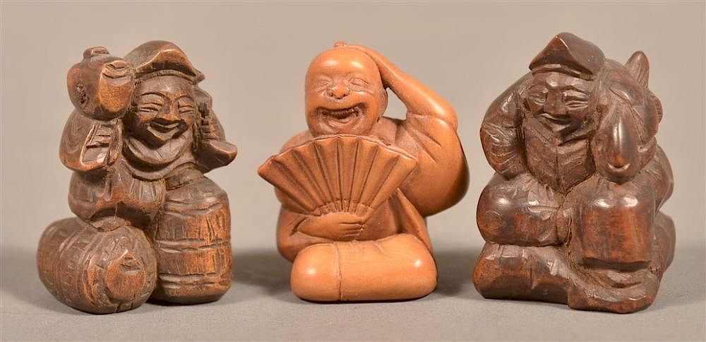 Appraisal: Three Carved Wood Chinese Figural Netsukes Three Carved Wood Chinese