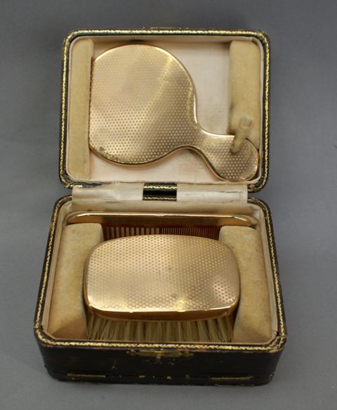 Appraisal: A boxed three piece toilet set mounted in silver gilt