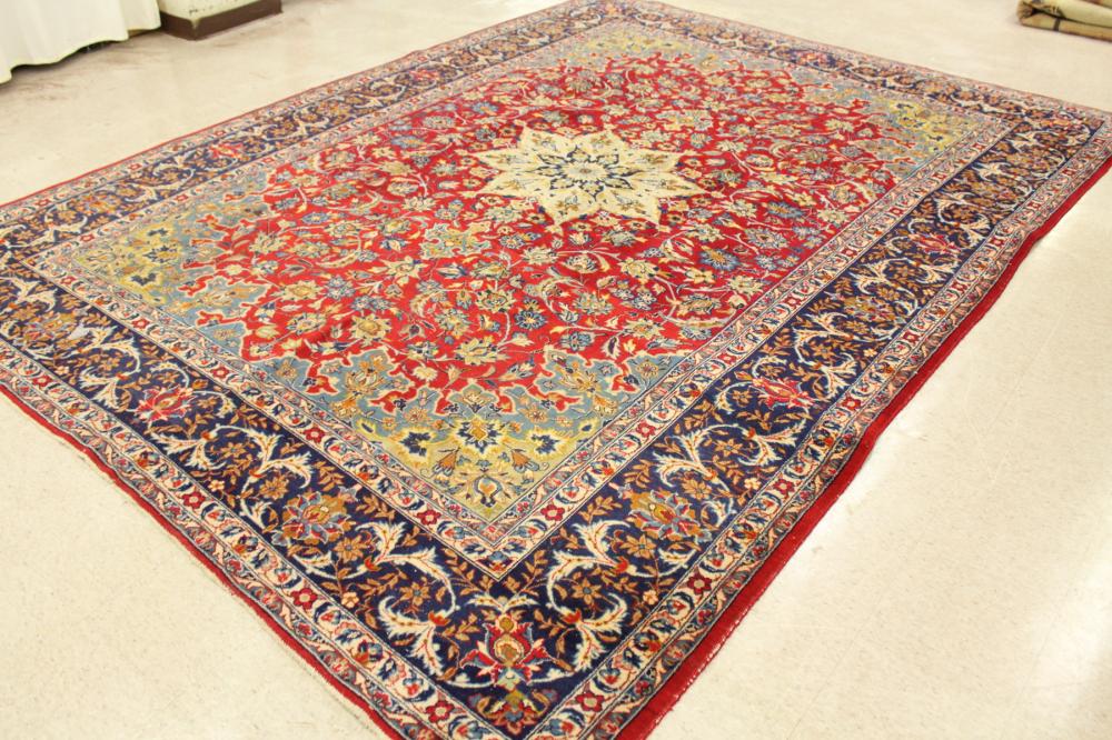 Appraisal: HAND KNOTTED PERSIAN CARPET floral and central floral medallion design