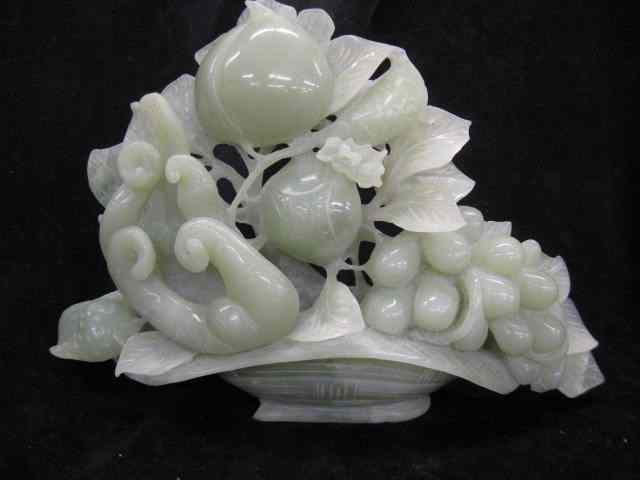 Appraisal: Chinese Carved Jade Figurine of a Basketof fruit on jade