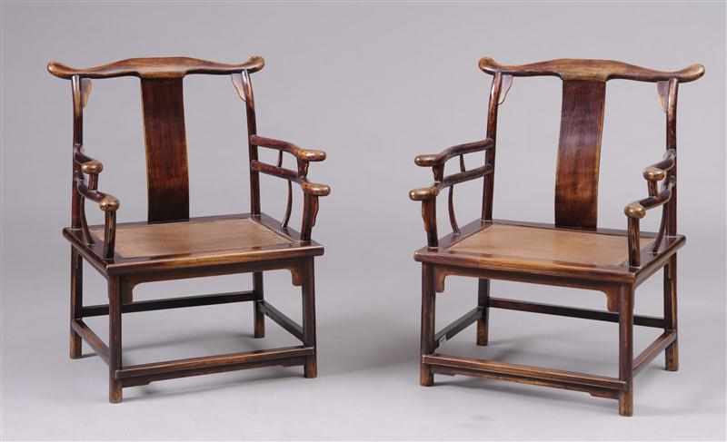 Appraisal: PAIR OF CHINESE HARDWOOD ARMCHAIRS Each ox-bow crest rail above