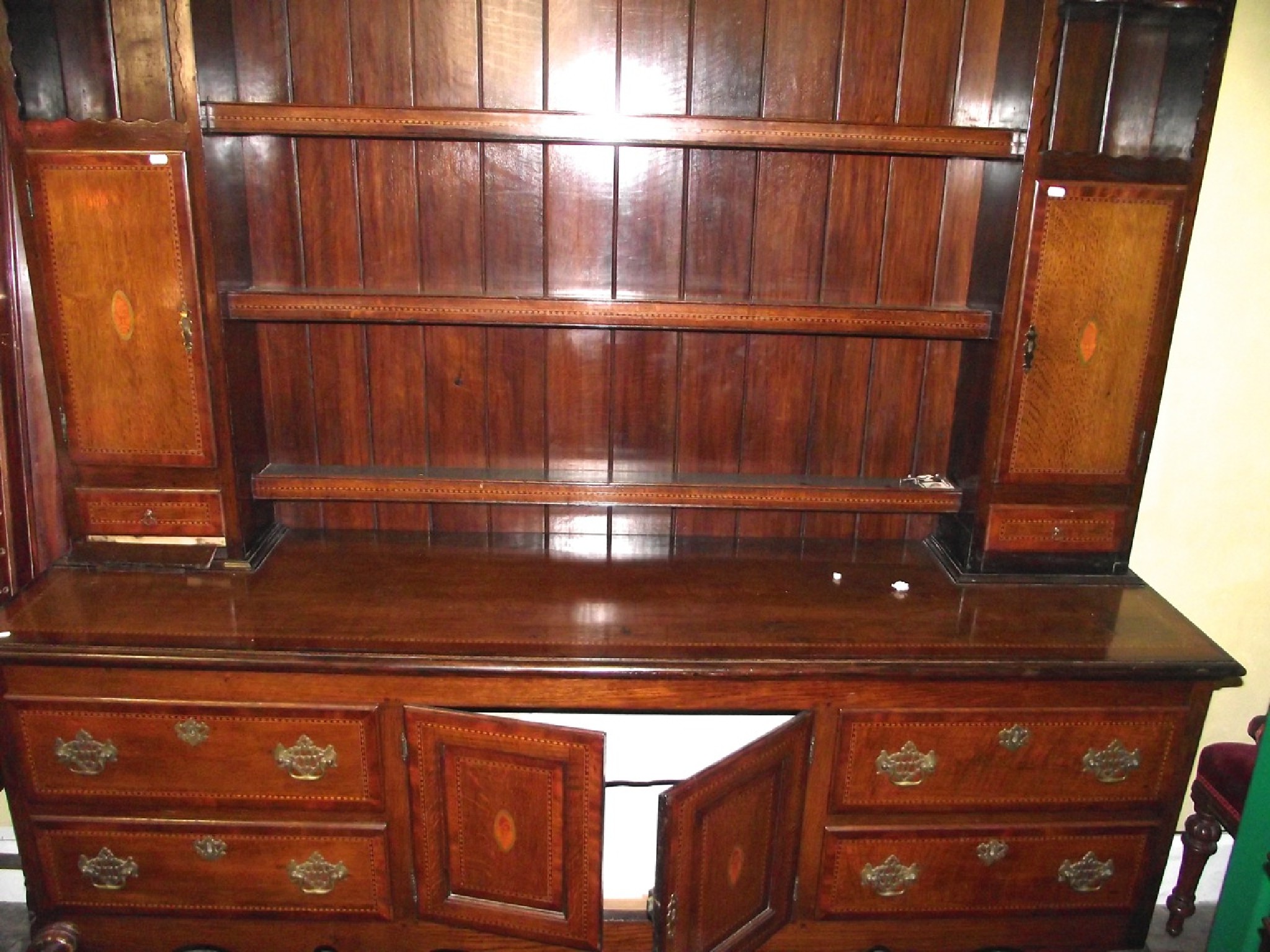 Appraisal: A substantial Georgian style oak dresser the lower section enclosed