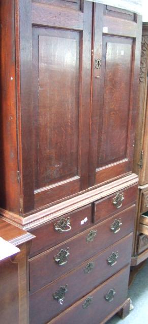 Appraisal: A late th century oak cabinet on chest the dentil