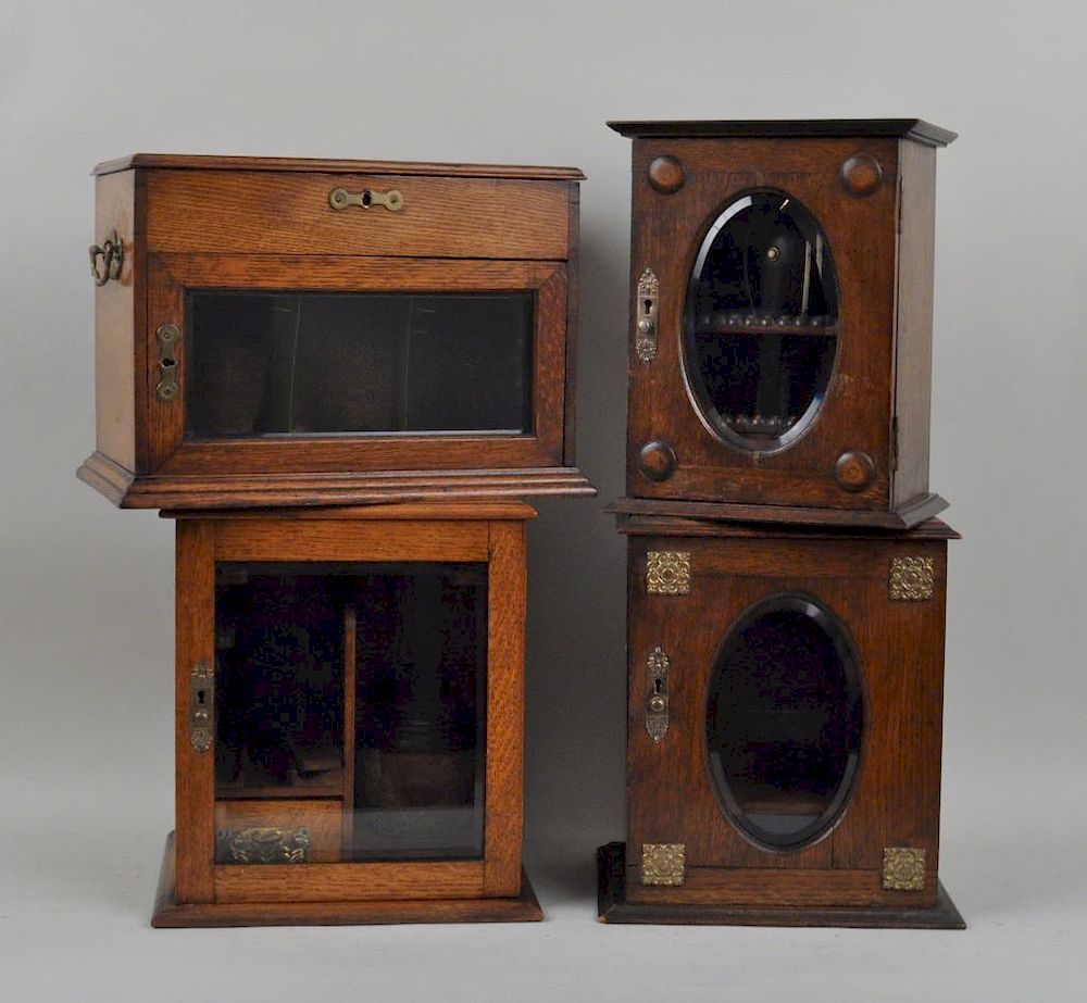 Appraisal: Group Four English Victorian Oak Tobacco Cabinets two with oval