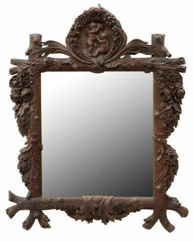 Appraisal: German Black Forest wall mirror early th c carved frame