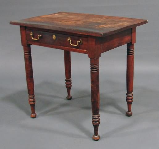 Appraisal: Single drawer with brasses replaced ring-turned round legs ball feet