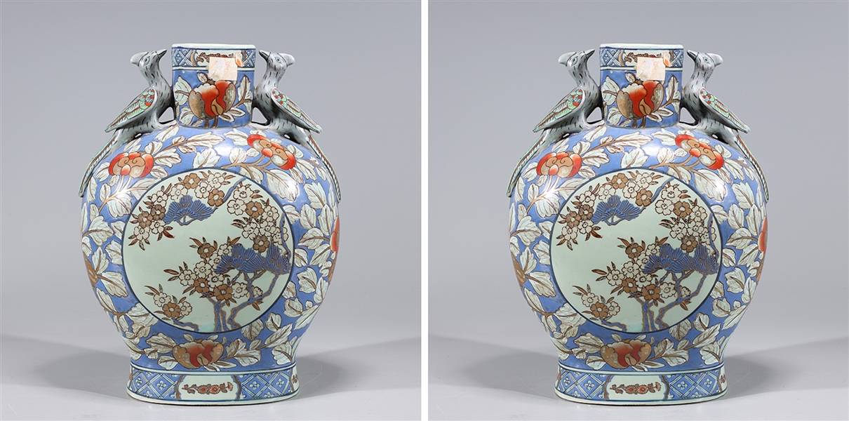 Appraisal: Two Chinese porcelain vases with floral designs gilt detail and