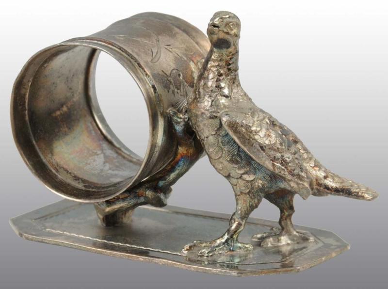 Appraisal: Large Bird Figural Napkin Ring Description Meriden Condition Excellent