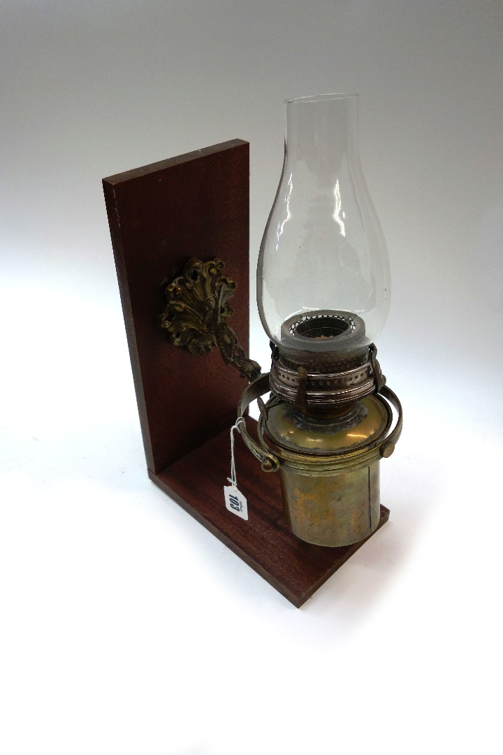 Appraisal: A ship's brass oil lamp in gimble mounting later attached