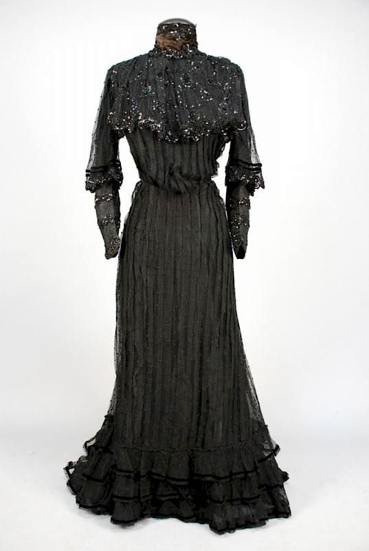 Appraisal: SEQUINED DOTTED NET GOWN c Two-piece black cotton the boned