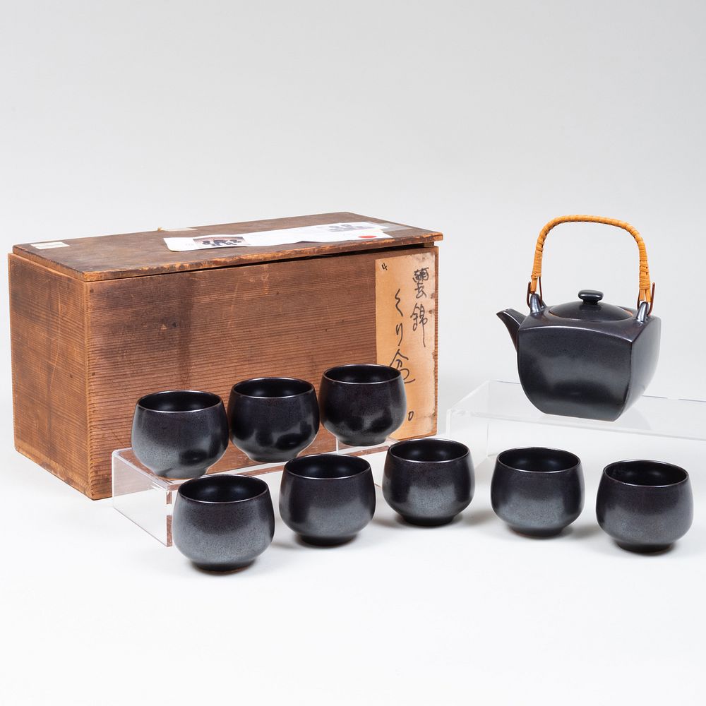 Appraisal: Japanese Black Glazed Porcelain Tea Service Comprising A teapot and