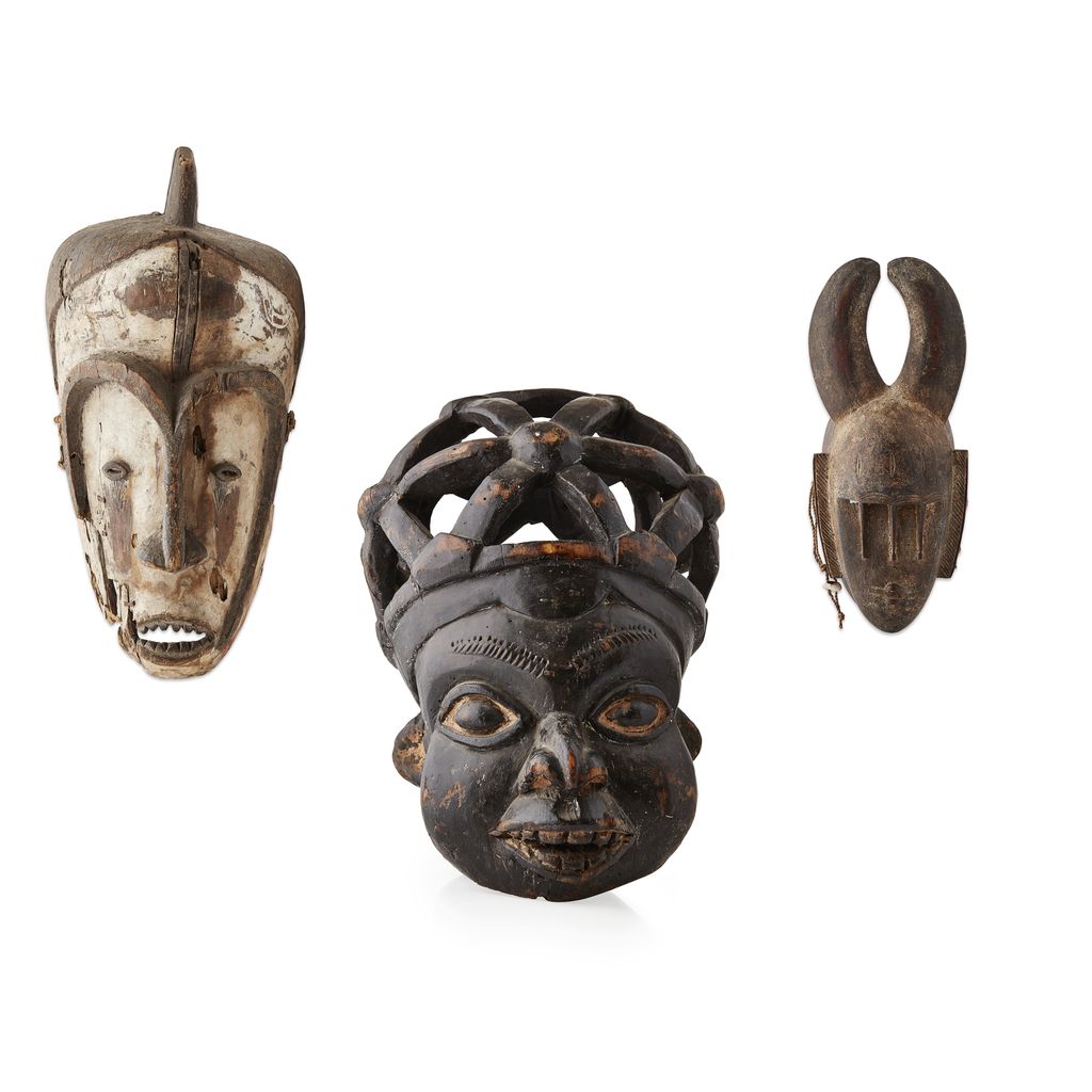 Appraisal: GROUP OF THREE CARVED WOOD TRIBAL MASKS TH CENTURY comprising