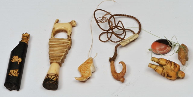 Appraisal: A COLLECTION TO INCLUDE an Inuit bone fishing hook with