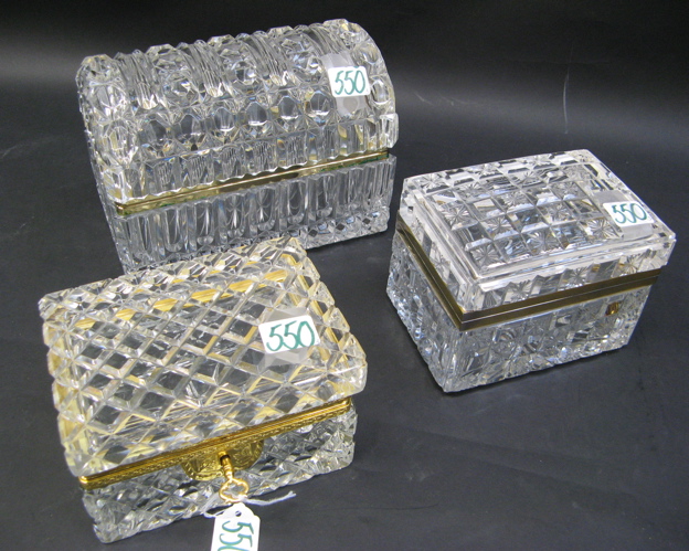 Appraisal: THREE CLEAR CUT GLASS TRINKET BOXES all rectangular form having