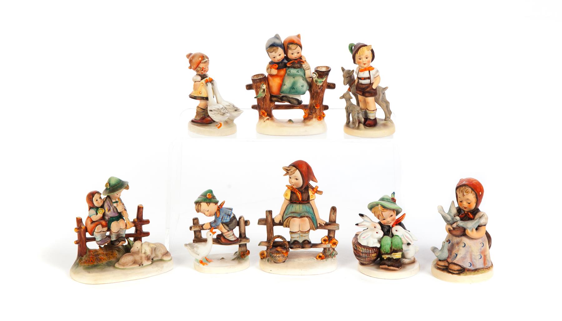 Appraisal: EIGHT HUMMEL FIGURINES IN COUNTRY SETTINGS Germany nd half- th